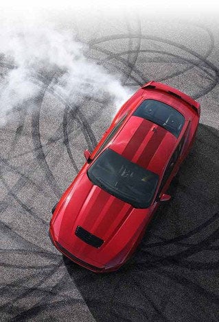 Overhead view of a 2024 Ford Mustang® model with tire tracks on pavement | Christie Motors in Langdon ND