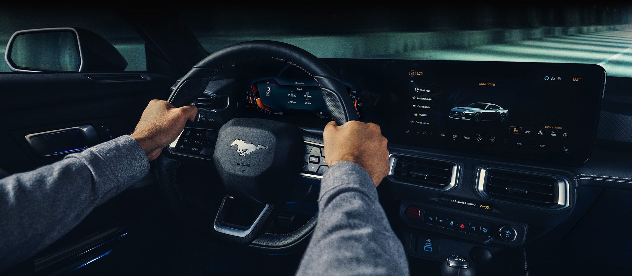 A 2024 Ford Mustang® model interior with a person driving | Christie Motors in Langdon ND